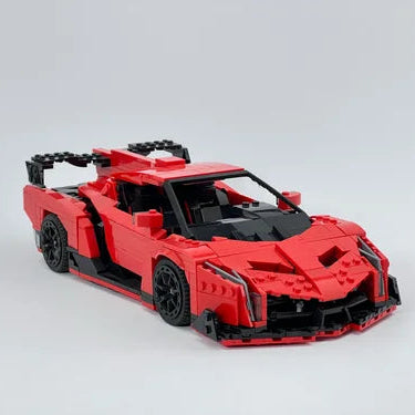 Red sports car model made of interlocking bricks on a light gray background
